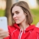 Young Woman Doing Selfie With a White Phone - VideoHive Item for Sale