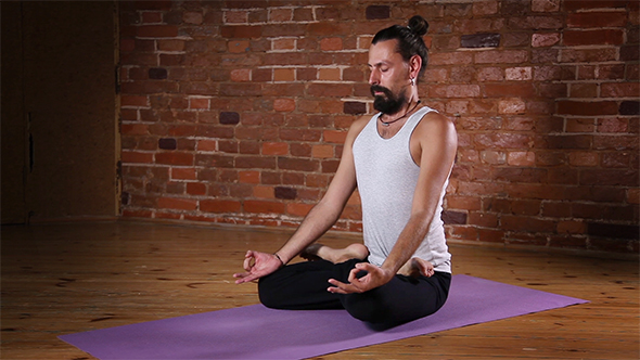 Man Meditating in Lotus Posture