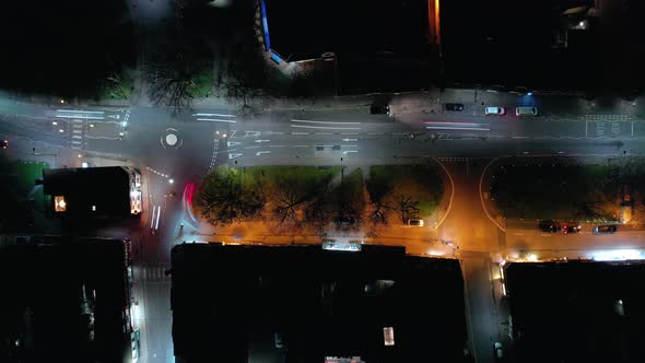 Bird's Eye View of a Town on a Friday Night with Cars and Revellers  alt