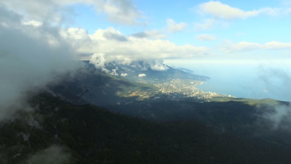 Mountains With City By The Sea