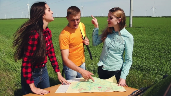 Two Young Tourist Determine The Route Map And Navigator