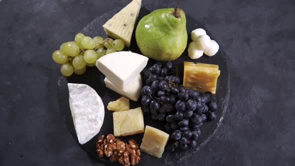 Cheese Plate Served with Grapes and Nuts