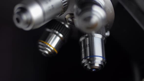 The Hand Changes The Objectives Of The Microscope