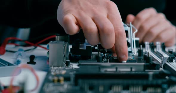 Close Up of Installing CPU MicroProcessor Into PC Motherboard with Thermal Paste