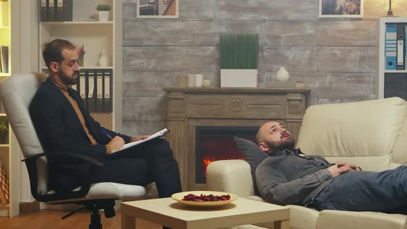 Man at Relationship Specialist Laying on Couch alt