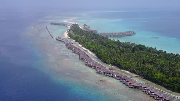 Aerial drone texture of island beach journey by blue water with sand background alt