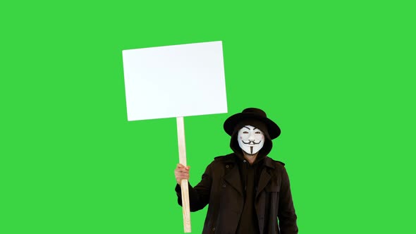 Anonymous Social Activist Demonstrating During Riot Against Government Policy and Action with Banner