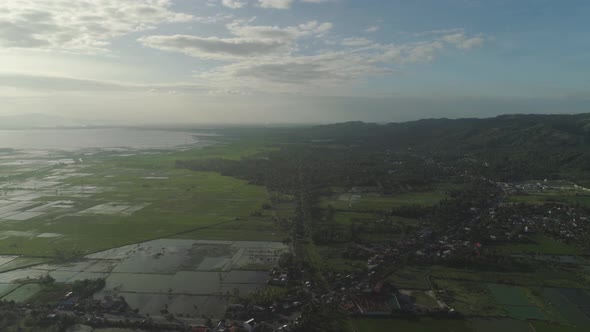 Landscape with a Lake, Farm Lands and Mountains alt
