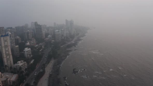 Drone shot along BJ road towards bandstand and Mumbai sealink on hazy day alt