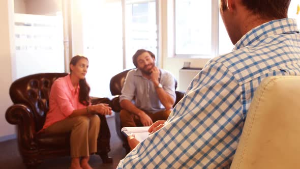 Group of businesspeople interacting with each other alt