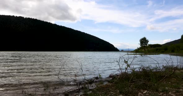 Fluffy Clouds Moving Under Frumoasa Lake In Harghita County, Romania