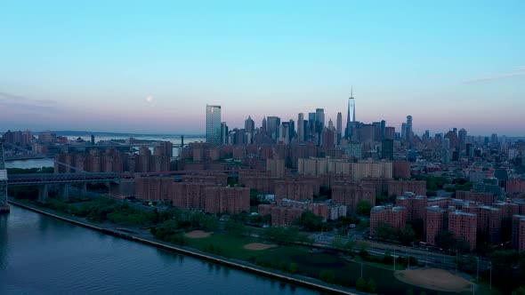 Aerial view on Downtown with Full moon at sunrise alt