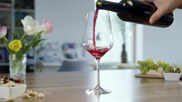 Pouring Red Wine In To Glass