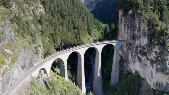 Landwasser Viaduct in Swiss Alps in Summer Aerial View on Green Mountain Valley alt