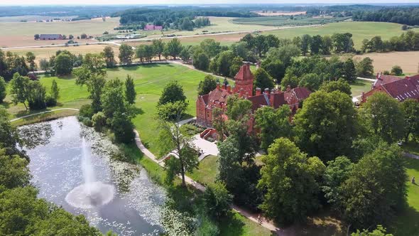 Jaunmoku Brick Medieval Castle Near Tukums, Latvia  Aerial Dron 4k Shot Jaunmokas Manor Park alt