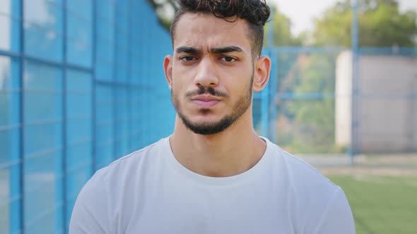Portrait Angry Disgruntled Young Middle Eastern Indian Student in Summer Sportswear alt