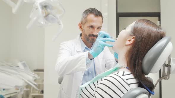 Cheerful Young Woman Smiling To the Camera After Dental Checkup