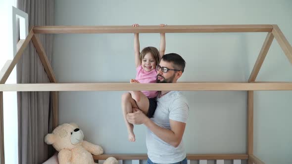 Happy Family Father with Child Play Active Games Do Gymnastics Look at Camera and Laugh