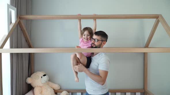 Happy Family Father with Child Play Active Games Do Gymnastics Look at Camera and Laugh alt