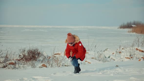 Winter Fun And Leisure Vacation In Weekend Adventure Trip. Woman In Red Parka Jacket. alt