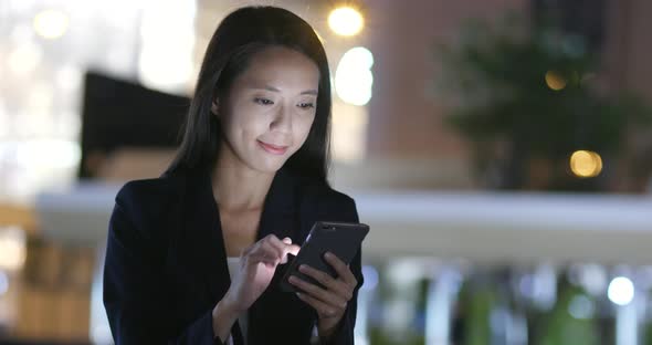 Businesswoman Use of Smart Phone in Hong Kong City at Night