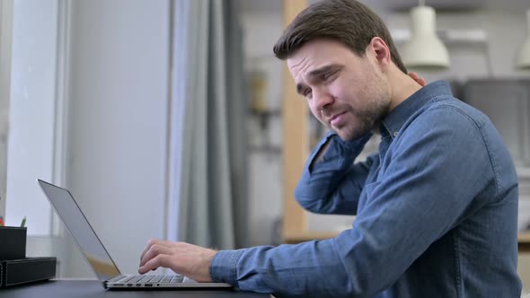 Beard Young Man Having Neck Pain on Office Desk alt