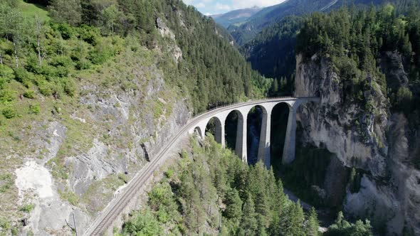 Landwasser Viaduct in Swiss Alps in Summer Aerial View on Green Mountain Valley alt