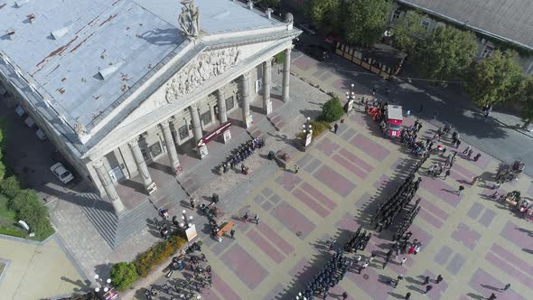 Aerial view of a military parade in front of the Theatre  alt