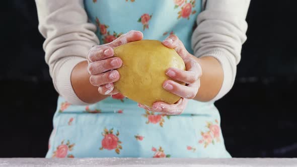 Woman molding a dough alt