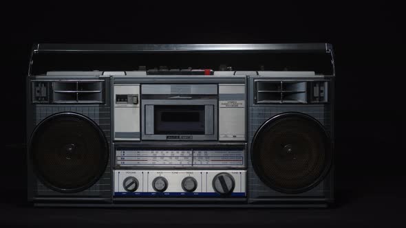 Old Vintage Cassette Microphone on a Black Background alt