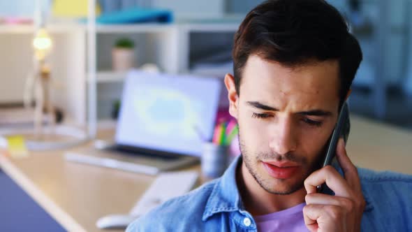 Creative executive talking on mobile phone 4k alt