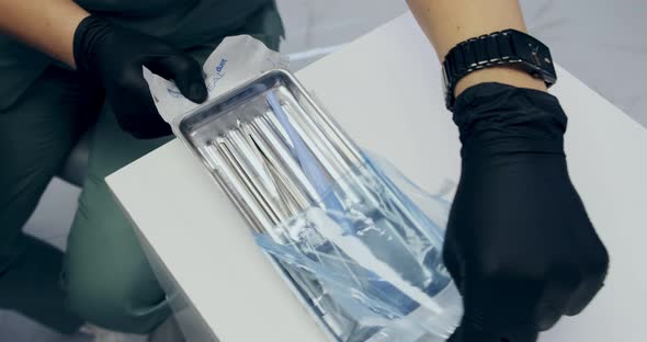 Frame in Dentistry Nurse Prepares the Tools alt