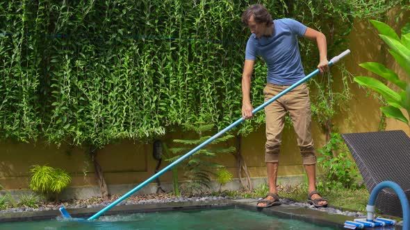Young Man Professional Swimming Pool Cleaner Does Pool Cleaning Service alt