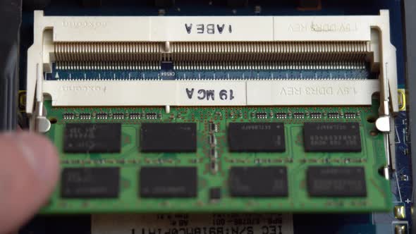 Belarus Minsk 25 May 2021 Inserting RAM Into a Laptop Connector Laptop Repair and Maintenance at alt