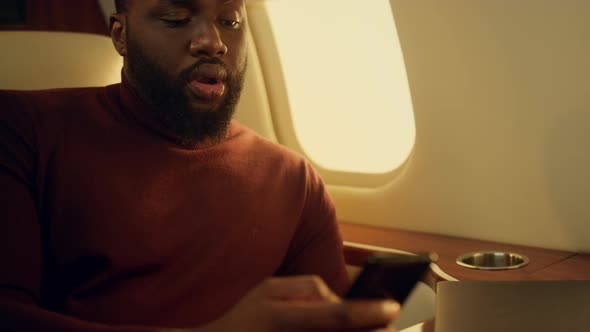 Happy Entrepreneur Calling Friend on Business Trip Closeup alt
