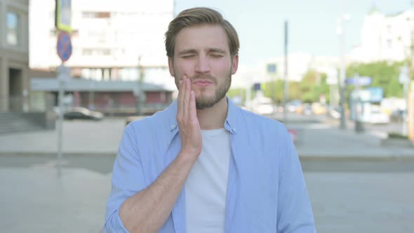 Portrait of Man Having Toothache Outdoor alt