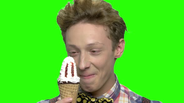 Close Up Portrait of Teenage Boy Enjoying Ice Cream alt