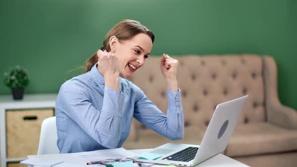 Joyful Woman Making Gesture Winner Celebrating Successful Deal alt