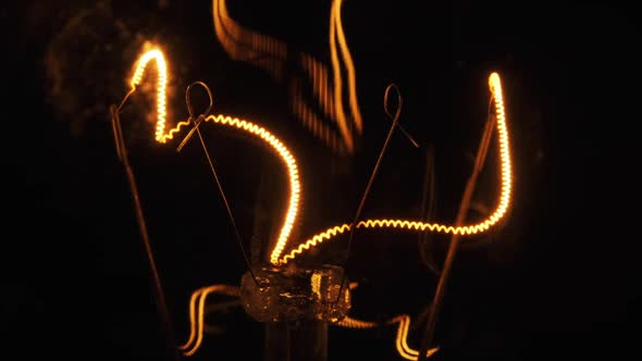 The Tungsten Filament in Classic Incandescent Glass Lamp Heats Up and Cools Down alt