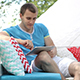 Young Man Uses Tablet Outdoors - VideoHive Item for Sale