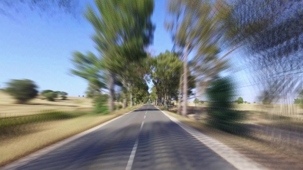 Speedy Driving On a Road In Countryside
