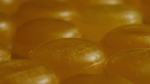 Rotating shot of butterscotch candies - CANDY BUTTERSCOTCH 048 alt