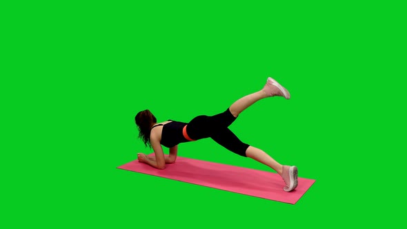 Young Sporty Female in Black Bodysuit Doing Sports on Green Screen 