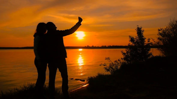 Young Couple Taking Selfie Photo On Beach During Sunset, Super 