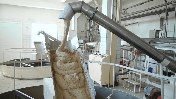 Kneading And Feeding Dough Into The Hopper alt