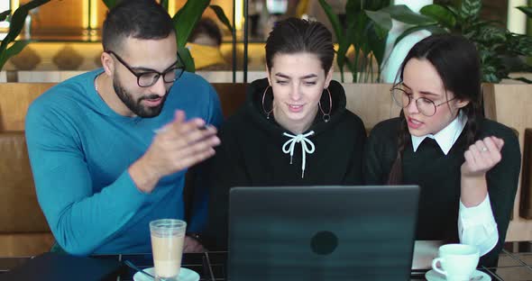 Students Using Laptop for Project