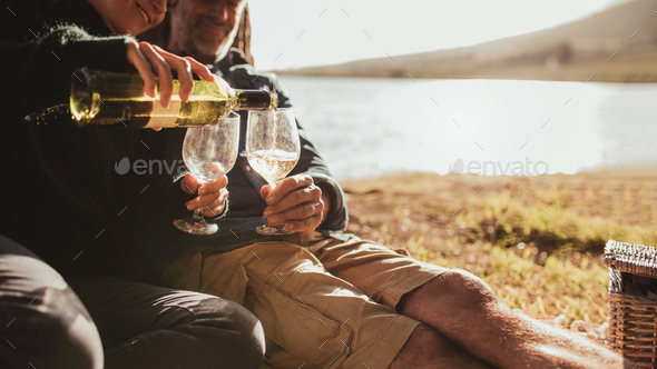 Couple enjoying wine on camping trip
