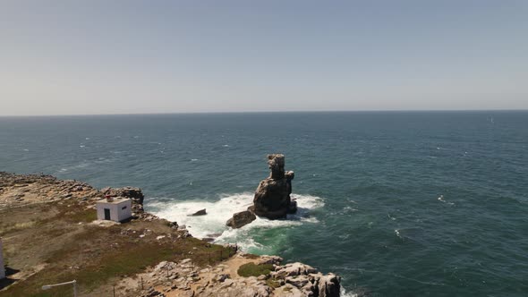 Nau dos Corvos or Ship of Crows, Carvoeiro cape, Peniche in Portugal. Aerial circling