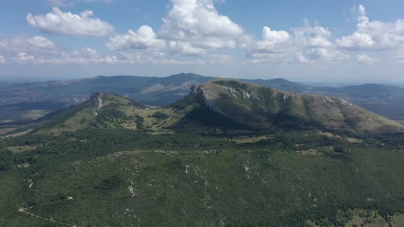 High above mountain Stol with ranges of Deli Jovan in background 4K drone footage