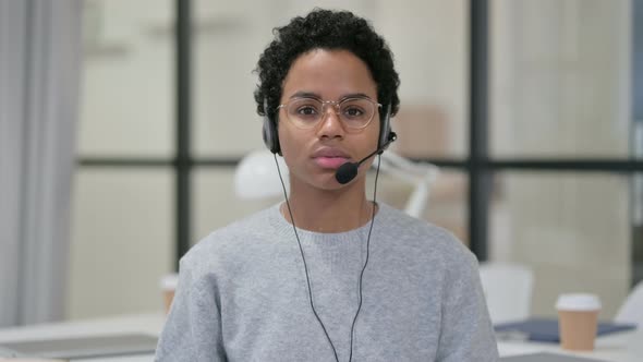 Portrait of African Woman Wearing Headset with Mic  alt